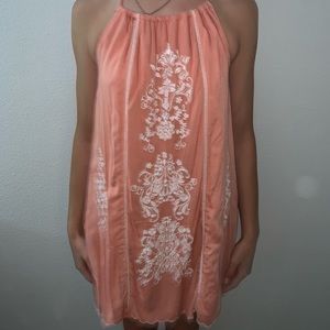 Coral dress with white laced pattern